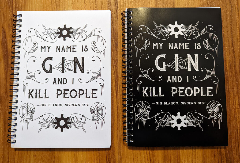 Gin Blanco black and white notebooks with text quote from Spider's Bite