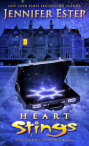 Heart Stings purple cover art with suitcase filled with diamonds